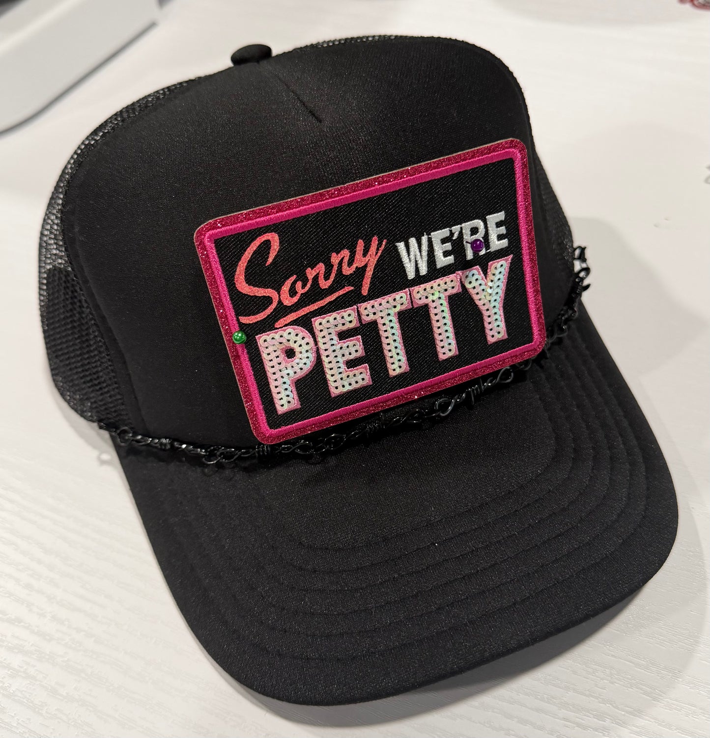Sorry, We’re Petty Trucker Hat