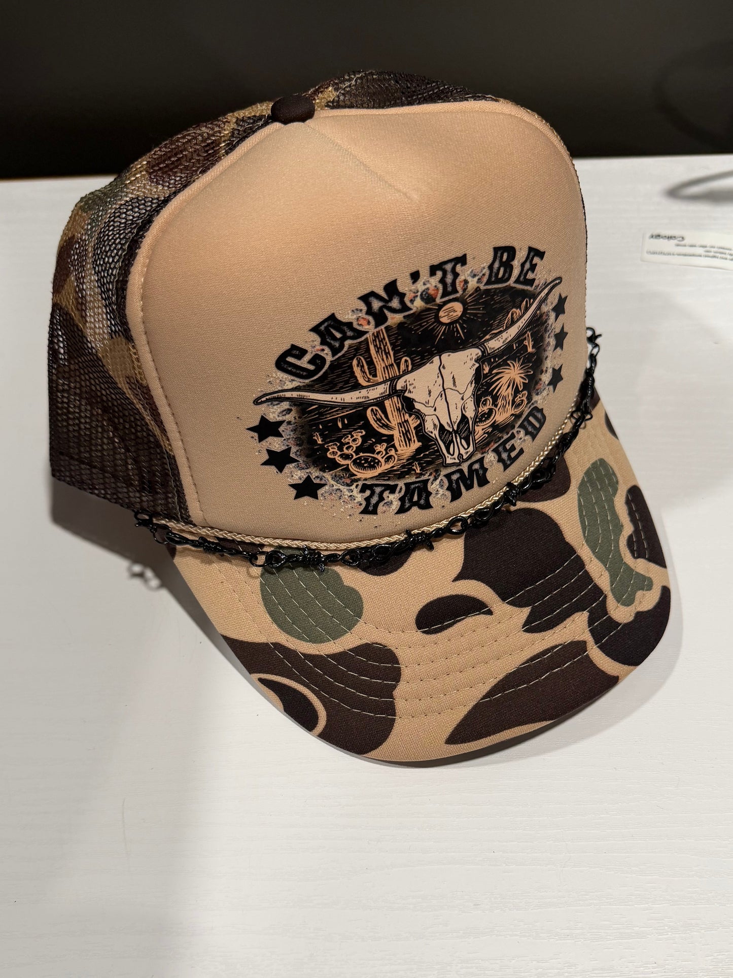 Can’t Be Tamed Trucker Hat